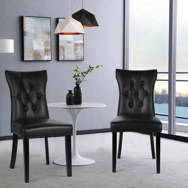 Two black PU leather dining chairs with buttons 92cm H