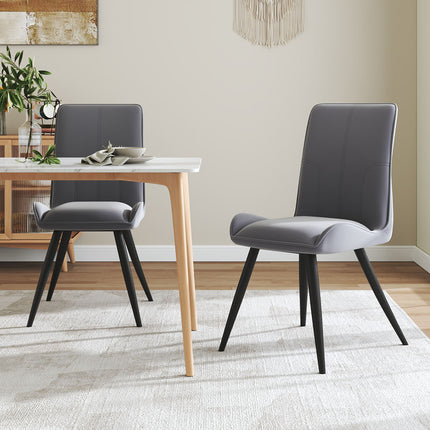 Two dining chairs in a grey set with velvet upholstery